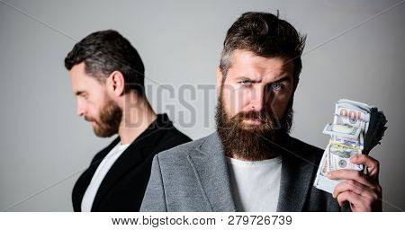 Scam And Deception. Man Bearded Fraudster Hold Cash Money While Victim Stand Sad Background. While N