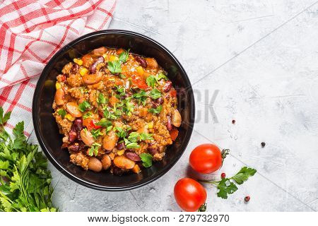 Chili Con Carne From Meat, Beans And Vegetables In Black Plate On Stone Table. Traditional Mexican F