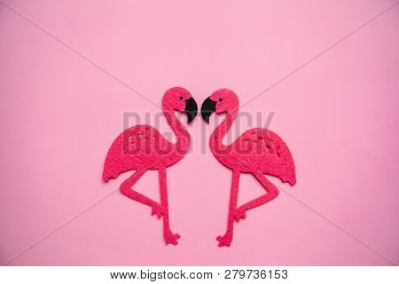 Two Red Flamingos On A Pink Background In Minimal Style.