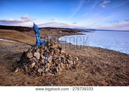 Sacred Place With Obo. Winter Landscape Of Mongolia. Lake Khubsugul