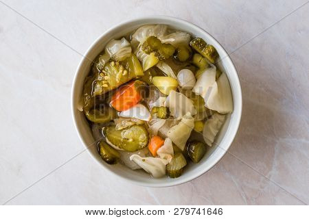 Mix Of Turkish Pickles With Hot Green Pepper, Cabbage, Sauerkraut, Carrot And Cucumber In Bowl.