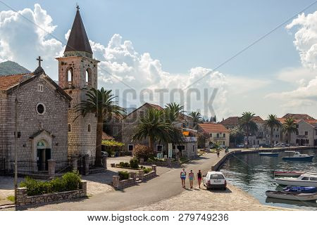 Donja Lastva, Tivat, Montenegro, August 06, 2014: The Catholic St. Roko Church, Ancient Stone Houses