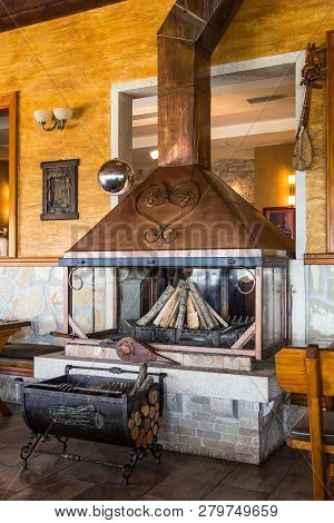 Bogetici, Municipality Niksic, Montenegro, August 08, 2014: Beautiful Stylish Brass Fireplace In The