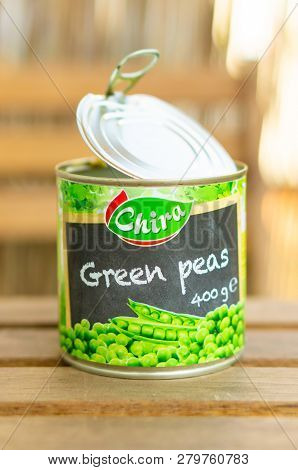 Poznan, Poland - October 10, 2018: Chira Green Peas In A Open 400 Gram Can On A Wooden Table