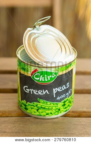 Poznan, Poland - October 10, 2018: Chira Green Peas In A Open 400 Gram Can On A Wooden Table