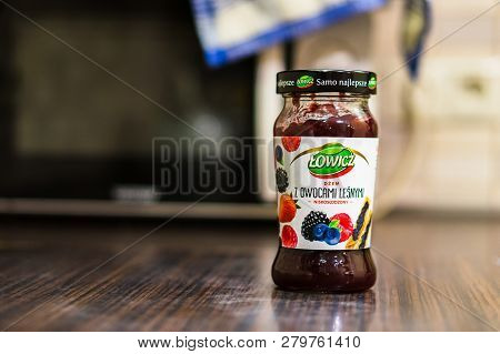 Poznan, Poland - November 20, 2018: Polish Lowicz Forest Fruit Jam In A Glass Jar Standing On A Tabl