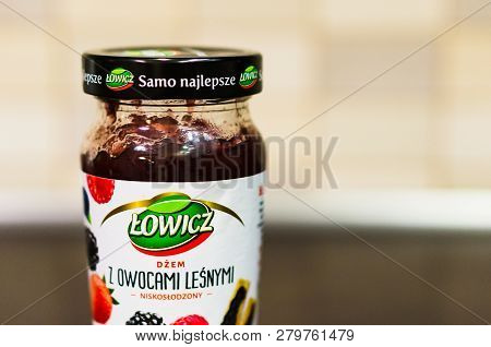 Poznan, Poland - November 20, 2018: Polish Lowicz Forest Fruit Jam In A Glass Jar On A Wooden Table.