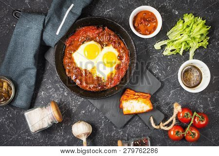 Shakshuka, Fried Eggs In Tomato Sauce In Iron Frying Pan. Typical Israel Food.