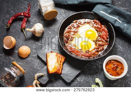 Shakshuka, Fried Eggs In Tomato Sauce In Iron Frying Pan. Typical Israel Food