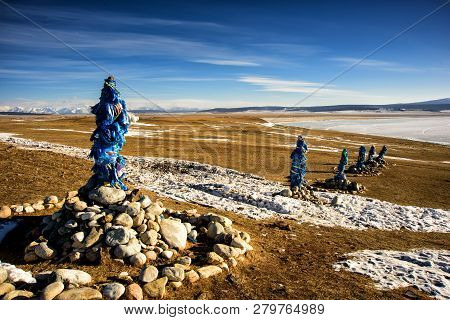 Sacred Place With Obo. Winter Landscape Of Mongolia. Lake Khubsugul And Mountain