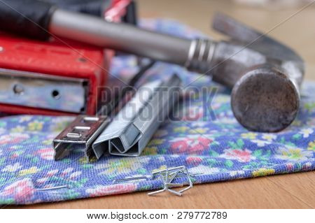 Tacker And Staples Used To Upholster Furniture. Accessories For Employees In The Carpentry Shop.