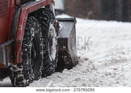 Close-up Red Small Snowblower Clears Snow From The Street After A Big Snowstorm/ Snowy Winter, Snowt