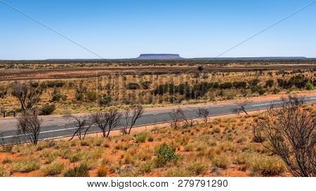 Distant View Of Mount Conner With Lasseter Highway In Nt Central Outback Australia