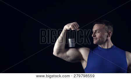 Handsome Bodybuilder Man Or Sexy Muscular Smiling Guy In Blue Vest With Athlete Body, Torso And Ches
