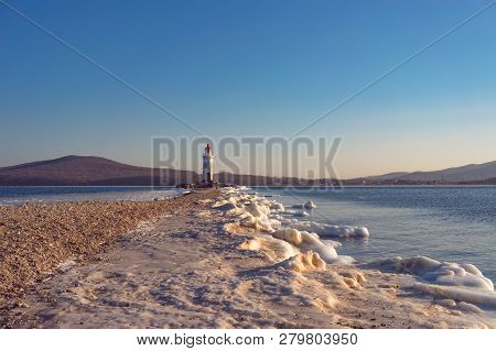 Seascape Overlooking The Tokarev Lighthouse Against The Blue Sky.