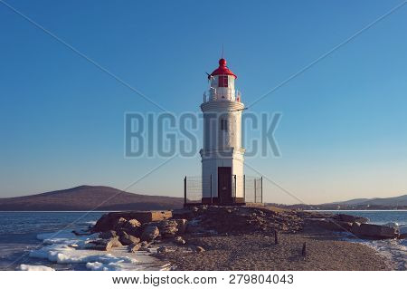 Seascape Overlooking The Tokarev Lighthouse Against The Blue Sky.