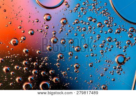 Macro Shot Of Backlit Gas-liquid Emulsion Over Colored Background. Simple Beauty Of Physics. Light D