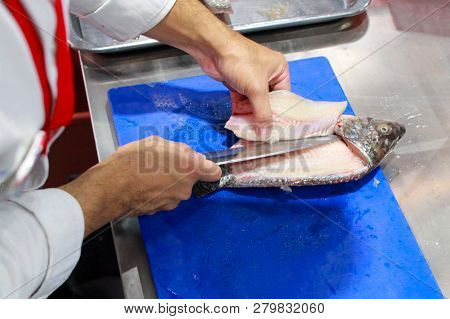 Chef Cooking Raw Fish On Kitchen, Process Of Cooking Fish