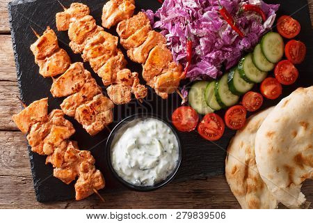 Traditional Taouk Chicken Kebab With Fresh Salad, Yogurt Sauce And Pita Bread Close-up. Horizontal T
