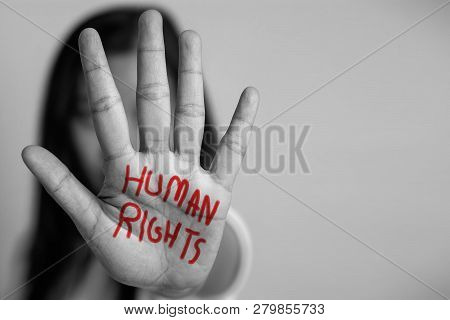 Human Rights Concept. Woman Raised Her Hand For Dissuade, Hand Write The Word Human Rights In Red Co