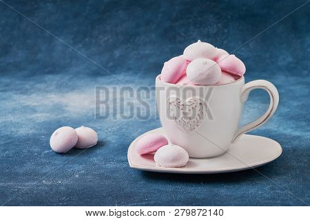 Meringue Cookies In Cup With Heart, Blue Background. Selective Focus. Valentines Day Concept. Copy S