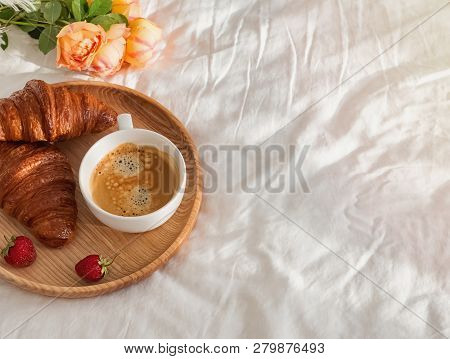Coffee And Delecious Croissants On The White Bed Linen With Copy Space