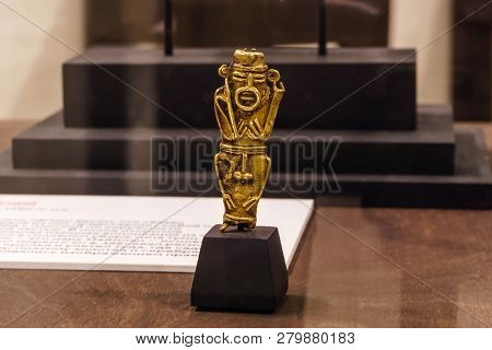 Yekaterinburg, Russia - January 17, 2019: Golden Pendant In The Form Of A Nude Male Figure Of Ancien