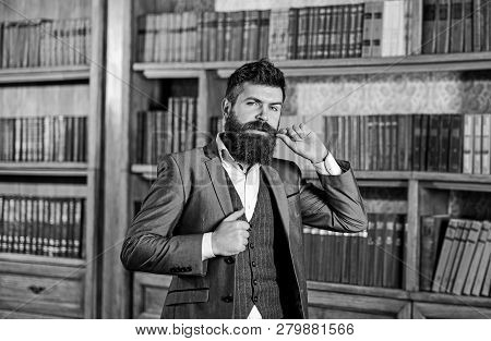 Senior Man With Long Beard Standing In A Vintage Librar