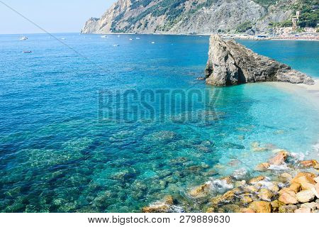 The Coast Of Monterosso. View Of Monterosso Al Mare Beach, In Summer Season, A Coastal Village And R