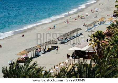 Almunecar, Spain - June 8, 2018 View Of The Tourist Town Of Almunecar On The Costa Tropical In Spain