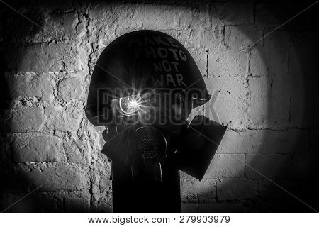 Art Picture Of A Military Gas Mask On A White Brick Wall With Shadows With Flash With The Inscriptio
