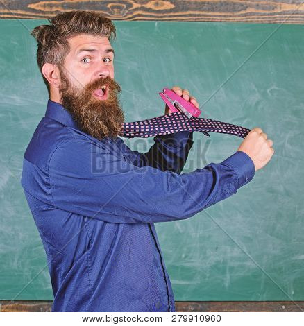 Hipster Teacher Formal Wear Necktie Holds Stapler. School Stationery. Man Scruffy Use Stapler Danger