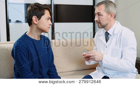 Hearing Impaired Young Man At The Doctors Office.