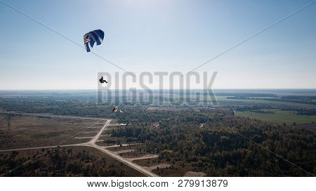 Paraglider Flies Over Fields. High Altitude. The Athlete Turns The Thermal Current. Rise Up. Weather