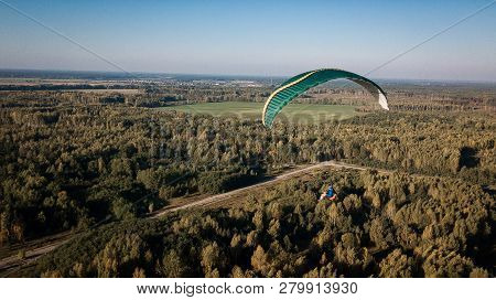 Paraglider Flies Over Fields. High Altitude. The Athlete Turns The Thermal Current. Rise Up. Weather