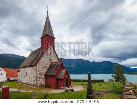 12th century Romanesque Gothic Dale Church in Luster village on the Lustrafjord (Lustrafjorden) fjord, branch of greater Sognefjord (Sognefjorden), Luster, Sogn og Fjordane, Norway, Scandinavia