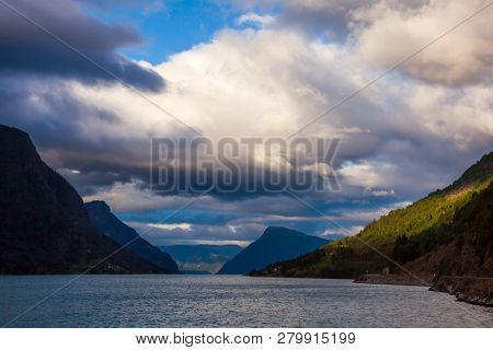 Dramatic sky over the Lustrafjord or Lustrafjorden fjord, branch of greater Sognefjord or Sognefjorden (the King of the Fjords), 
Luster municipality, Sogn og Fjordane, Norway, Scandinavia