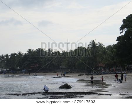 Anyer, Indonesia - June 26, 2018: Many People Getting Activities On Sambolo Beach.