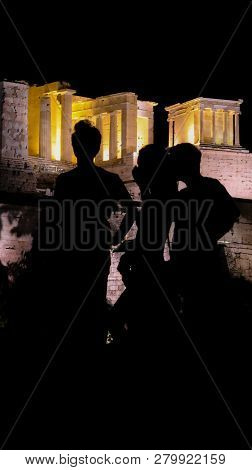 Silhouettes Of Tourists, Visitors And Locals At The Acropolis