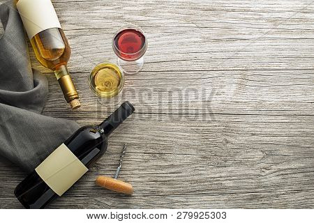 Glass And Bottle Of Red And White Wine On Wooden Background. Wine Bottle Mockup. Top View