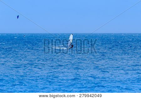 Malaga, Spain - May 25, 2018 Windsurfer Practicing Active Water Sport In The Bay Of Malaga, A Place