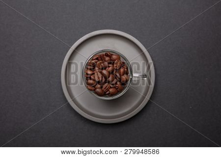 Coffee Cup And Beans On Black Color Background, Top View