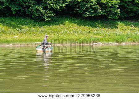 Dnister River Canyon, Ukraine - July, 2017: Fishermen On A Boat Ride Along The Dniester River.