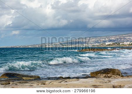 Beautiful View Of The Mediterranean Seashore With Kissonerga Village On The Background. Paphos, Cypr