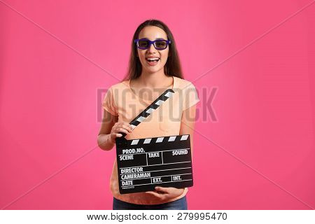 Woman With 3d Glasses And Clapperboard On Color Background. Cinema Show