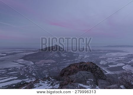 Sunrise On Boren Hill Near Bilina Town In Winter Frosty Color Morning