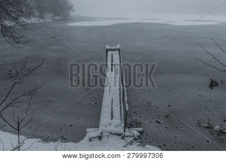Frosty Pond With Mist And Snow In Dark White Winter Day Near Spa Town Kynzvart