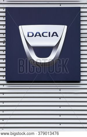 Risskov, Denmark - July 25, 2020: Dacia Logo On Wall Of A Dealer. Dacia Is A Romanian Car Manufactur