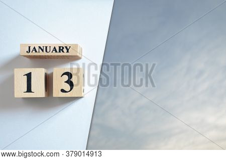 January 13, Blue Sky With Clound With Number Cube.