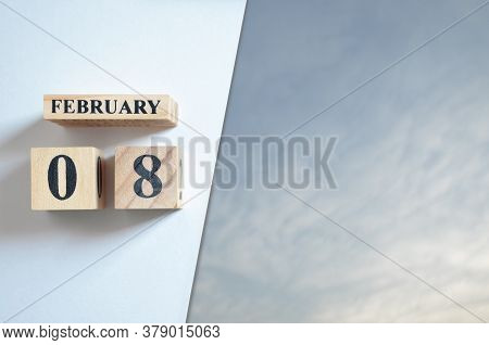 February 8, Blue Sky With Clound With Number Cube.